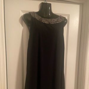 Black dress sequins on neck and hem. Size 18w  43in.length. used but great cond.